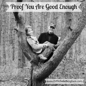 Title Image of Girl Sitting in Fork of Tree with Dad Looking On